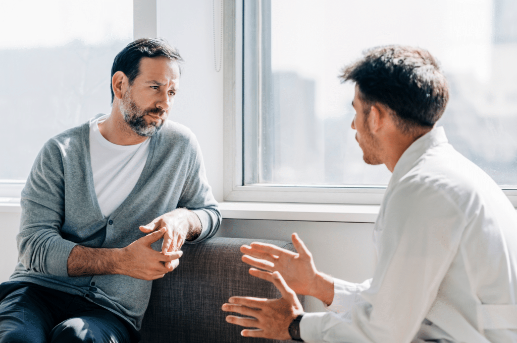 A patient and a counselor engaged in counseling for opioid addiction, emphasizing the vital role of open dialogue and support in treatment and recovery.
