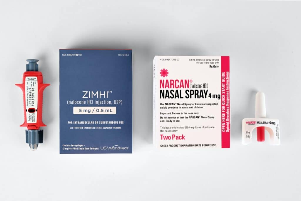 Image showing naloxone nasal spray and injection kits, over-the-counter medication used in harm reduction to reverse opioid overdoses effects, demonstrating a successful strategy in reducing opioid use impact.